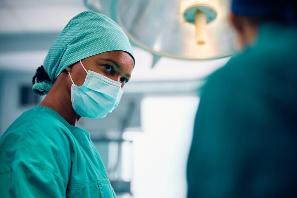 Black female surgeon in the operating room at medical clinic.